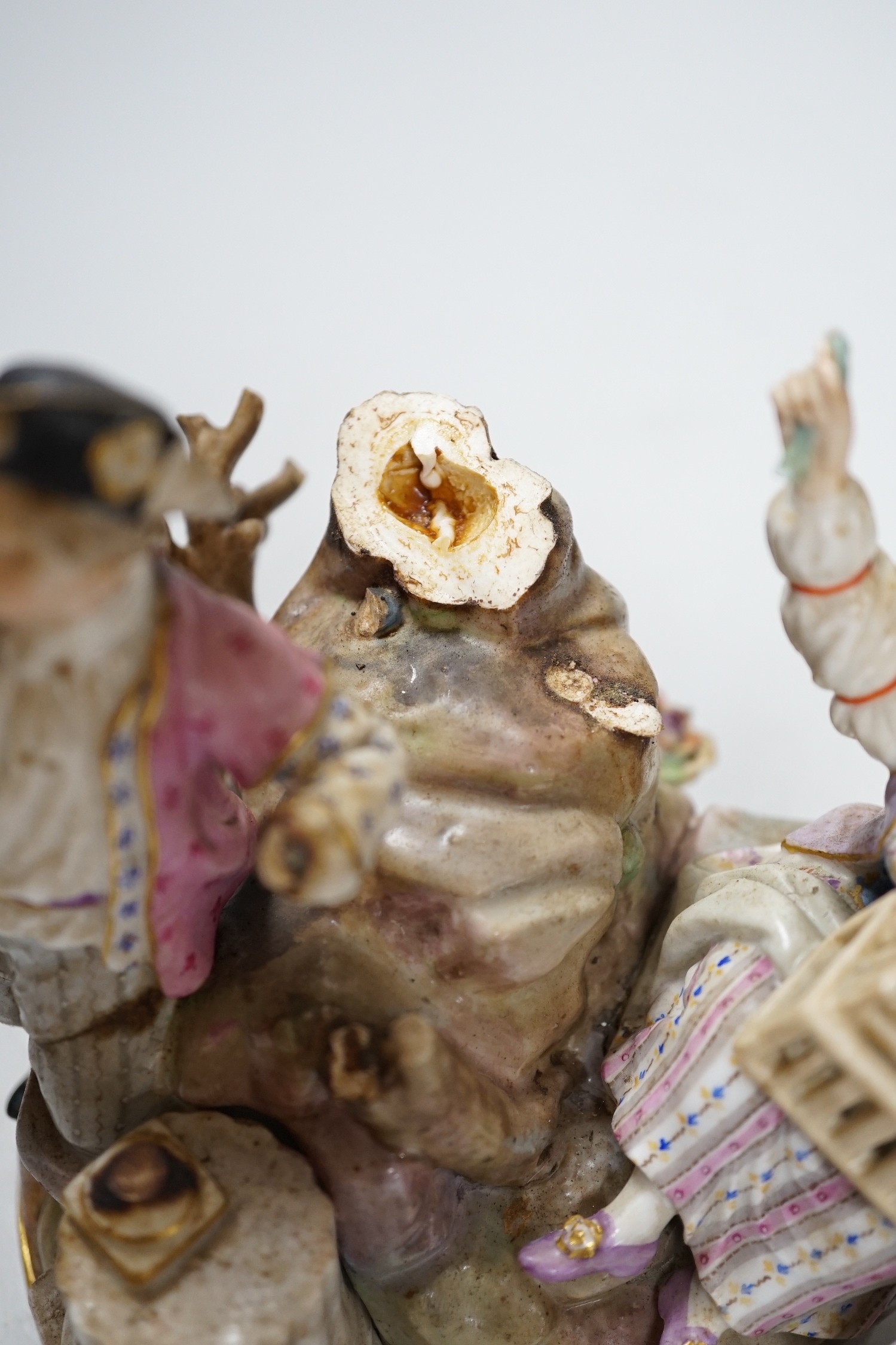 A Meissen group of flower pickers with bird cage, model F94 (a.f.)